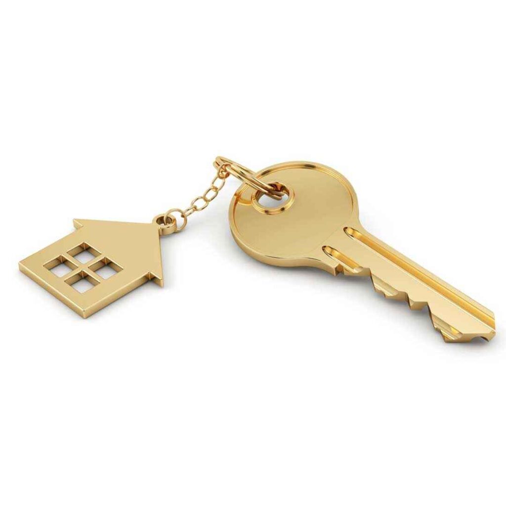 Gold key attached to a gold house-shaped keychain