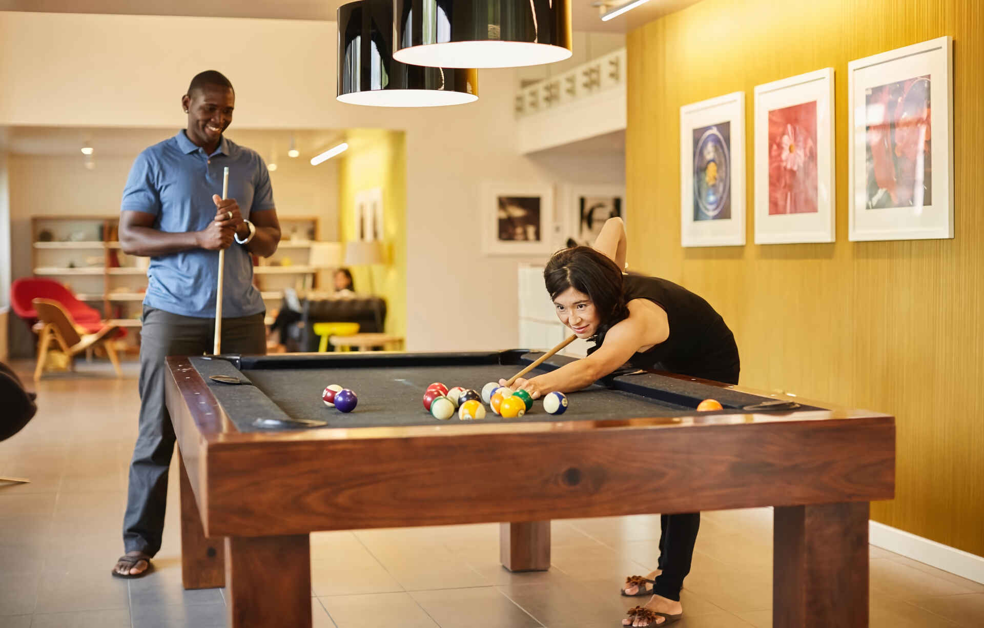 Friends playing pool