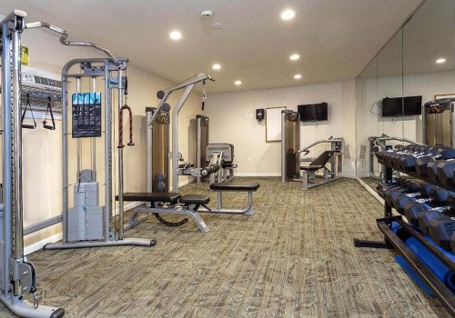 Fitness center with exercise equipment at Haverford Court apartments for rent in Philadelphia, PA