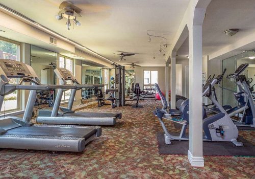 Fitness center with exercise equipment at Joshua House apartments for rent in Philadelphia, PA