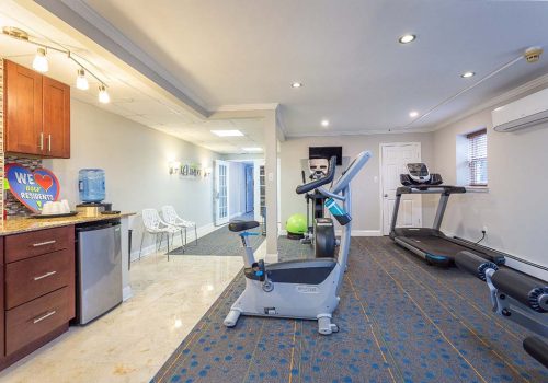 Fitness center with exercise equipment at Rosedale Court apartments for rent in Abington, PA
