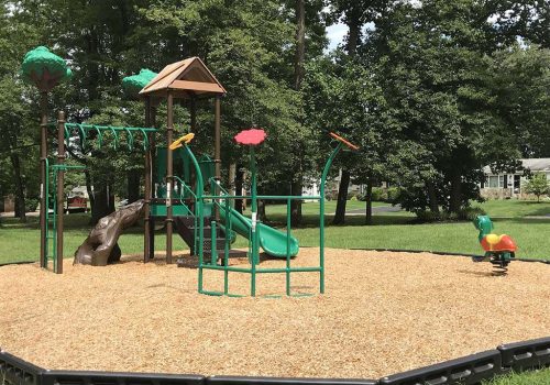 Playground with a green slide near Warrington Crossings apartments for rent in Warrington, PA