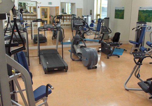Fitness center with exercise equipment at The Gateway Towers at Packer Park apartments for rent