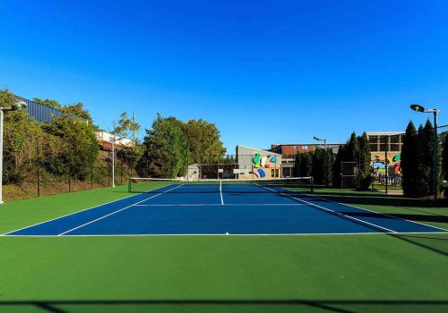 Outdoor tennis court at The Gateway Towers at Packer Park apartments for rent