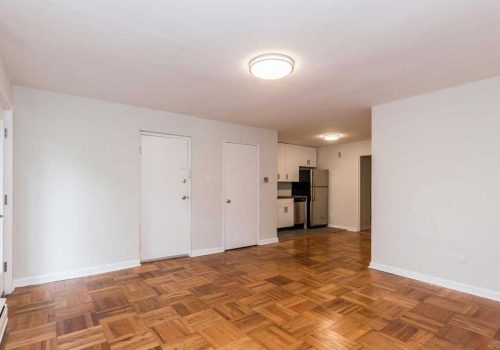 Open concept living and dining room with hardwood floors at Sedgwick Terrace apartments for rent.